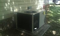 A packaged HVAC unit installed by J-CO beside a Selma home